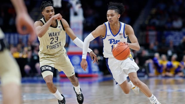 Pittsburgh Panthers guard Jaland Lowe (15) drives to the basket as Wake Forest Demon Deacons guard Hunter Sallis (23) chases in the first half at Capital One Arena in Washington, D.C., on March 14, 2024.
